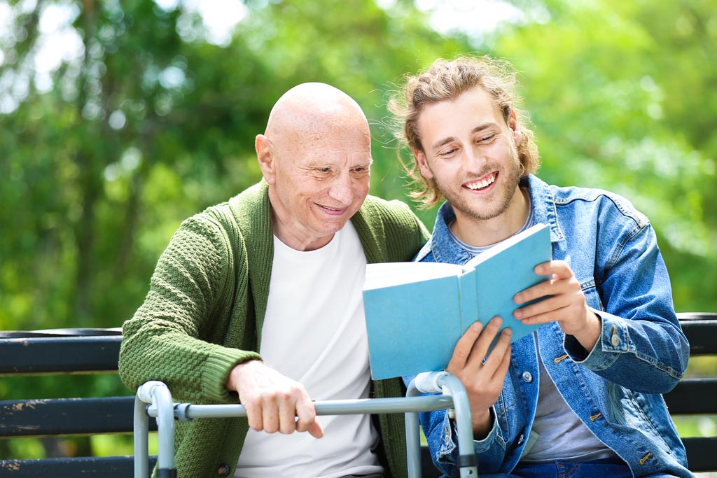 readingBookOldManYoungMan